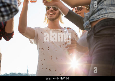 Adult friends partying on roof terrace Stock Photo