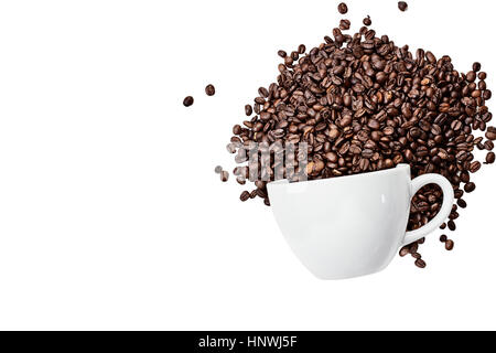 Top view of coffee beans spilling out of a ceramic cup isolated over a white background with room for copy space. Flat lay style. Stock Photo
