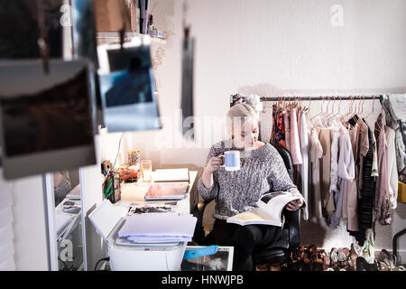 Female university student studying in the bedroom in her shared student house Stock Photo