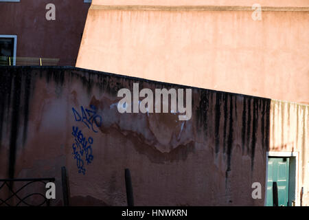Light and shade cast patterns on wall in Venice. Italy Stock Photo
