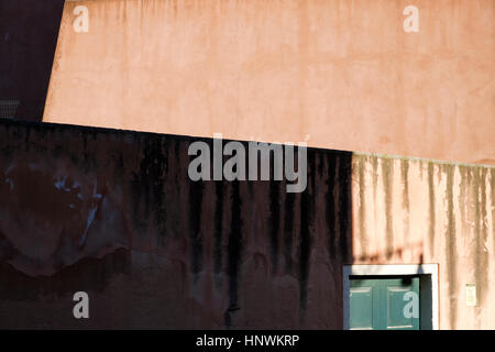 Light and shade cast patterns on wall in Venice. Italy Stock Photo