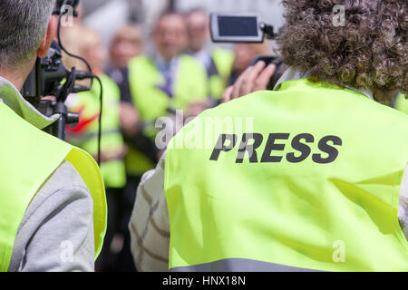 Filming an event with a video camera. News conference. Stock Photo