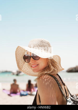 Portrait of woman wearing sunhat looking at camera smiling, Menorca, Spain Stock Photo