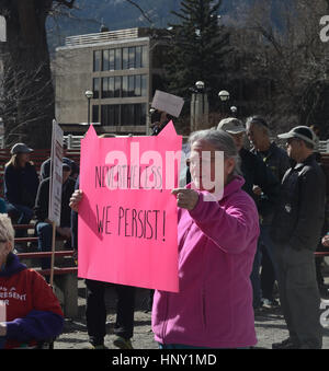 Protester holds 'Nevertheless we persist' sign in Boulder, Colorado Stock Photo