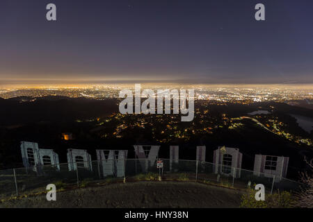 Los Angeles, California, USA - July 2, 2014:  Editorial view of the city of Los Angeles from hilltop behind the iconic Hollywood sign. Stock Photo