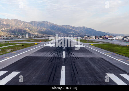 Burbank, California, USA - January 26, 2017:  Skid marks on runway at Burbank airport near Los Angeles, California. Stock Photo