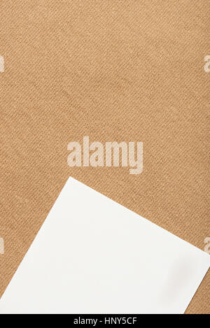 white tag on yellow textile texture background close up Stock Photo