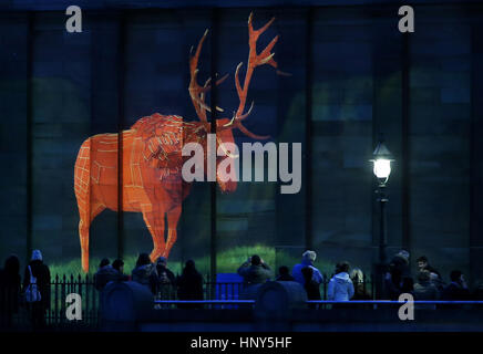 A specially-commissioned animation of a monarch-like stag is projected on to The National Galleries of Scotland building in Edinburgh to highlight its bid to buy The Monarch of the Glen painting by Victorian artist Sir Edwin Landseer. Stock Photo