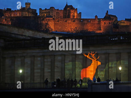 A specially-commissioned animation of a monarch-like stag is projected on to The National Galleries of Scotland building in Edinburgh to highlight its bid to buy The Monarch of the Glen painting by Victorian artist Sir Edwin Landseer. Stock Photo