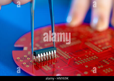 Setup IC on PCB. Assembly electronic device Stock Photo