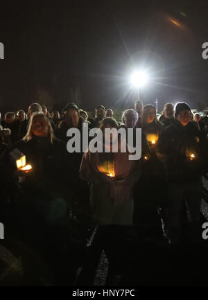 The crowd holding candles, listens as Sinn Fein's new leader at Stormont Michelle O'Neill addresses a commemoration in Clonoe, Co Tyrone in memory of IRA men, Patrick Vincent, Sean O'Farrell, Peter Clancy and Barry O'Donnell, who were killed by the SAS in February 1992. Stock Photo