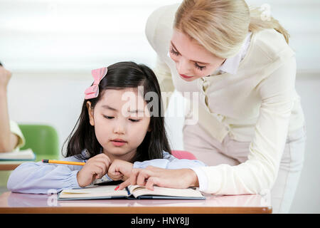 Kindergarten girl and foreign teacher Stock Photo