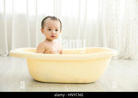 Baby boy in a tub Stock Photo