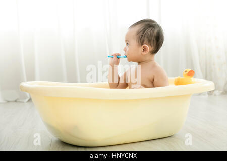 Baby boy in a tub Stock Photo