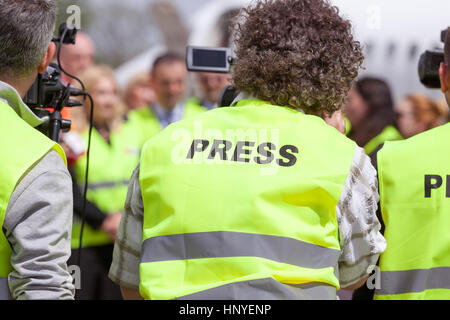 Shooting an event with a video camera. Press conference. Stock Photo