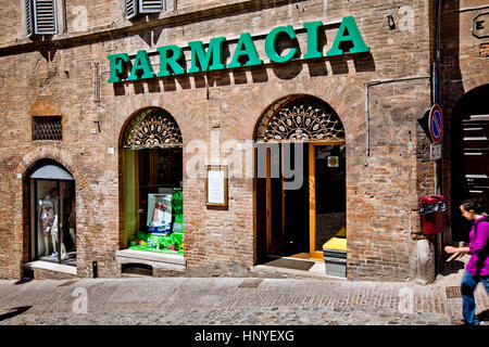 Urbino, Italy - May, 2011: Farmacia sign shop in Urbino city, Italy Stock Photo