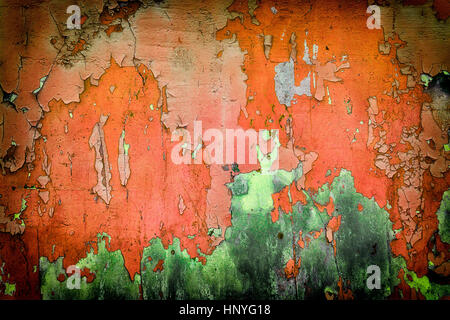 Very old red green wall with cracks. Suitable for background. Stock Photo
