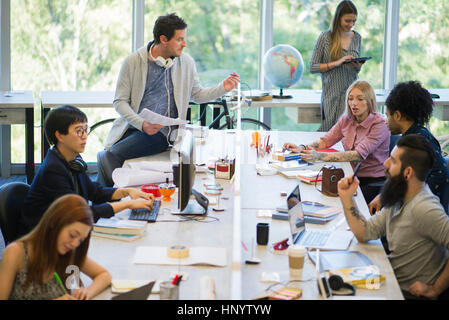 Creative professionals using shared office space Stock Photo