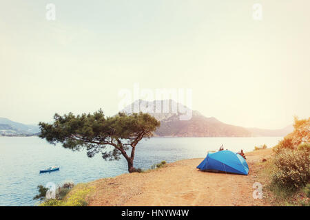 Blue tent on sandy wild beach at sunset light. Turkey Stock Photo