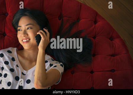 Young woman talking on cell phone Stock Photo