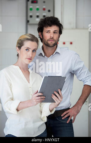 Colleauges using digital tablet Stock Photo
