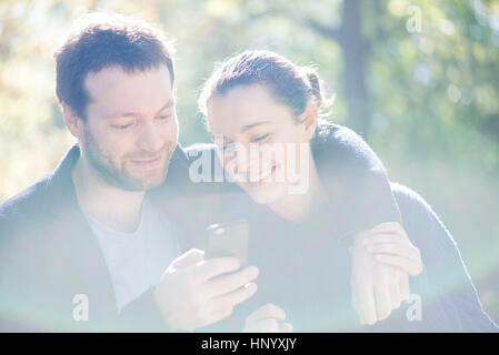 Couple using mobile app on smartphone for navigation Stock Photo