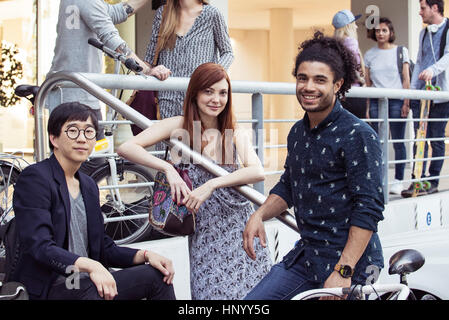 College students taking a break outdoors Stock Photo