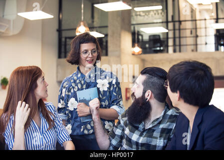 Colleagues working together in office Stock Photo
