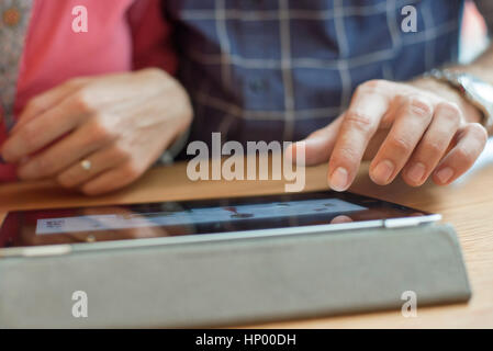 Couple using digital tablet, cropped Stock Photo