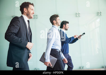Businessmen walking together with confidence Stock Photo