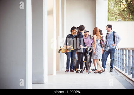 Group of college students chatting together after class Stock Photo