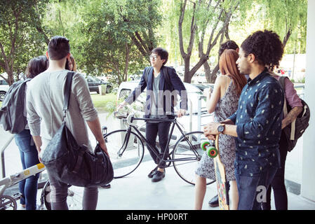 College students chatting after class Stock Photo