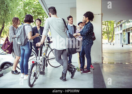 Group of coworkers chatting after work Stock Photo