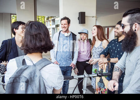 Group of colleagues chatting together outdoors Stock Photo