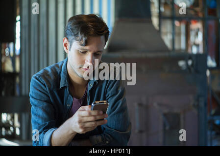 Man using smartphone Stock Photo
