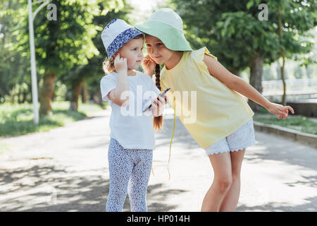 Happy girl with headphones to share music Stock Photo