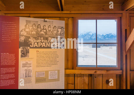 Manzanar, the World War II Japanese internment camp housing,  inside looking out through a window. with a lighted display inside. Stock Photo