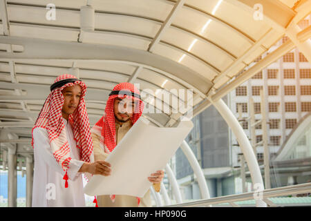 Arab Business people having consultanting about new project with city background. Stock Photo