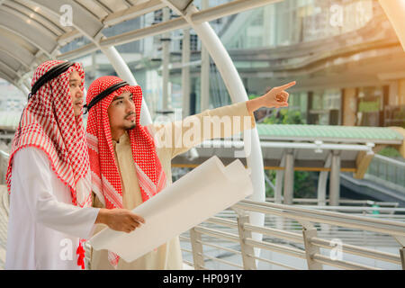 Arab Business people having consultanting about new project with city background. Stock Photo