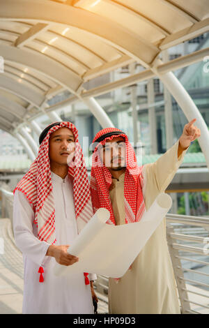 Arab Business people having consultanting about new project with city background. Stock Photo