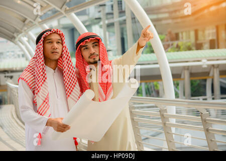 Arab Business people having consultanting about new project with city background. Stock Photo