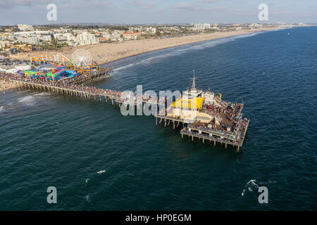 Santa Monica, California, USA - August 6, 2016:  Afternoon aerial of popular Santa Monica Pier and the Pacific Ocean near Los Angeles. Stock Photo