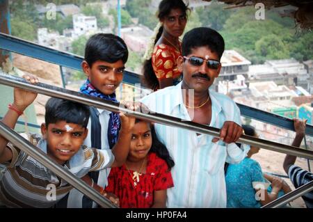 Hindu family climbing the steps to the Rock Temple in Thanjavur (Tanjore) in Tamil Nadu, South India Stock Photo