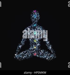Yoga man in lotus pose with chakras made of polygonal elements, glowing dots and particles for your design Stock Vector