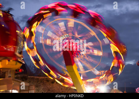 carousel in night lights blur motion Stock Photo
