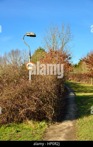 Tonbridge, Kent, England. No cycling sign among trees on a footpath Stock Photo