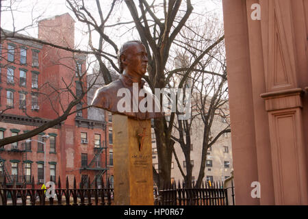 A bust of John Hughes, the first Archbishop of the Archdiocese of New York, stands outside Old St. Patrick’s Cathedral on Mott Street in Chinatown. Stock Photo