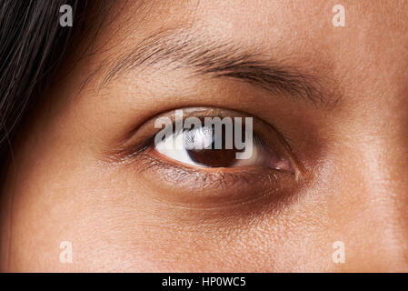 Macro of woman dark brown eye without cosmetic or makeup Stock Photo