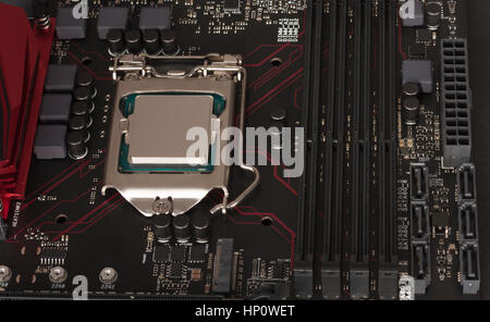 Close up of installed CPU processor on modern, new, gaming motherboard. Stock Photo