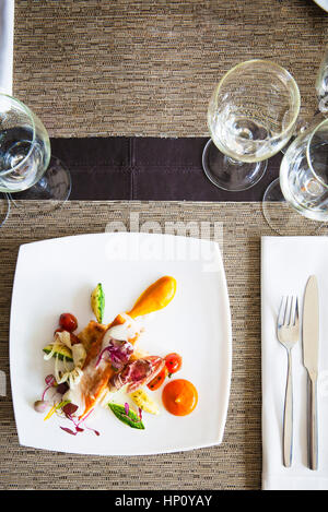 Salmon and vegetable dish served in restaurant Stock Photo